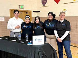 Focus on Community team at Community Feud event